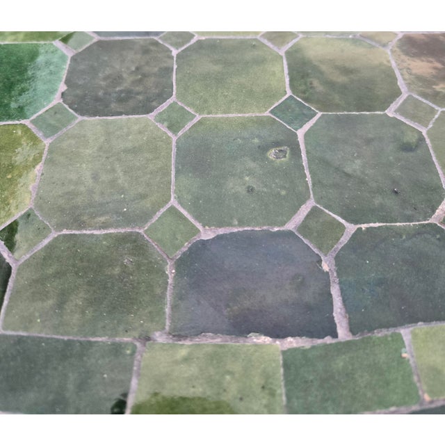 Beautiful handcrafted Moroccan mosaic table featuring an elegant green color palette. Measuring 48 inches in diameter,...