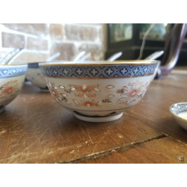 Great looking set of 8 bowls and 8 porcelain spoons all with blue, red and gold decorative details..also translucent rice...