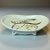 A vintage footed bowl / centerpiece made in Grand Junction, Colorado. The pottery features a teal glaze and hand-painted...