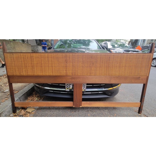 Jack Cartwright walnut king headboard with full length hand woven cane inlay Dimensions: 78 in wide x 1 in deep x 41 in high
