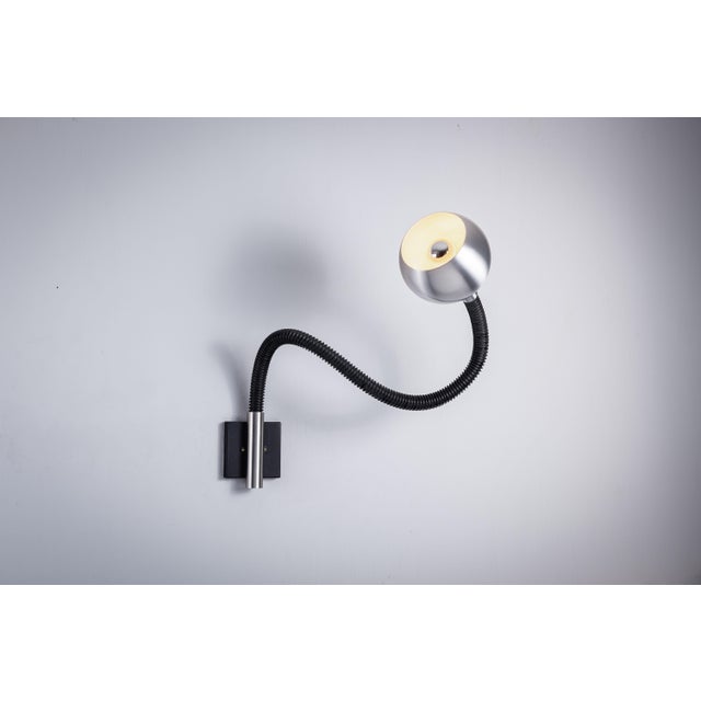 The ‘‘Serpent’’ wall lamp by Raak Amsterdam is a striking piece of lighting design that effortlessly combines...