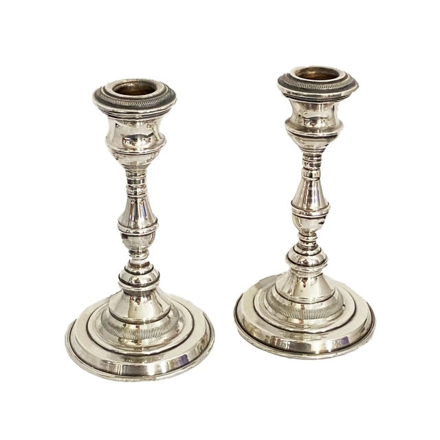 Exquisite vintage pair of weighted sterling silver candle holders, featuring a height of 6.5 inches at the tallest point...
