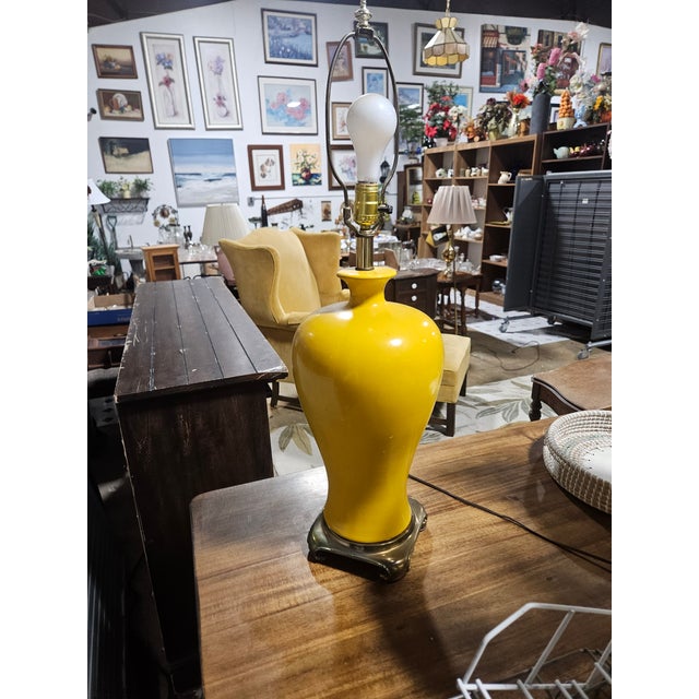 Retro yellow lamps with yellow shades that stand 32" tall. Chrome pottery. Rare with little to no wear. Shades are in...
