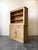 A primitive antique English pine hutch with lots of character! Deep upper shelves and ample lower cabinet storage make...