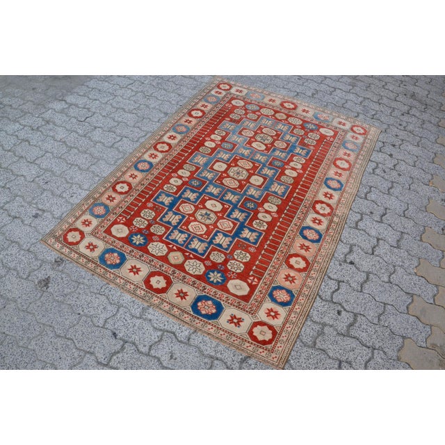 This is a vintage Turkish Oushak rug from the 1960s. The piece was hand-knotted.