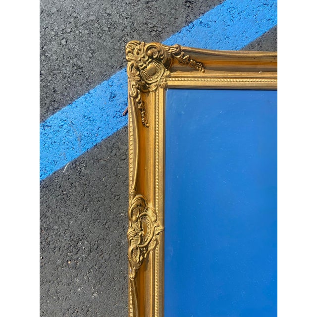 Stunning, ornate mid-size vintage giltwood mirror. Add an elegant touch of old world glamour to a room with this nicely...