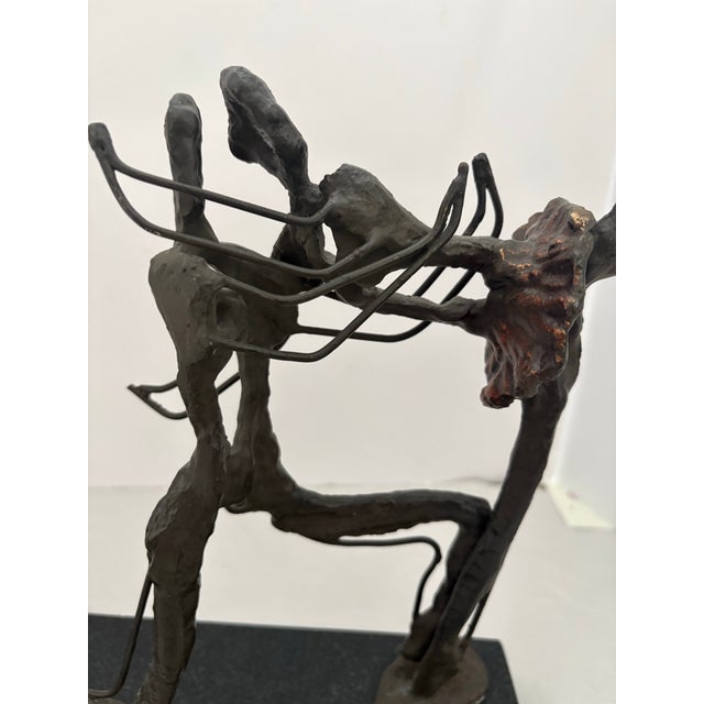 A compelling mid-century modern abstract sculpture depicting two ballet dancers in dynamic duet. Hand-built in patinated...