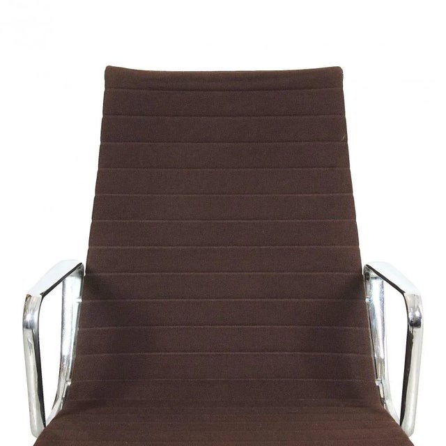 Charles Eames EA-122 chair in brown hopsak fabric from around the 90s. These chairs are from the same place and are in the...