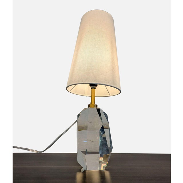 Designed by Kelly Wearstler, this lamp features a faceted, architectural body made of crystal with a linen tapered shade....