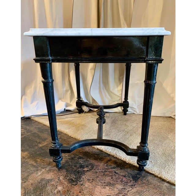Well, who doesn't like black and white together, this napoleon III writing table in glossy restored black lacquer topped...