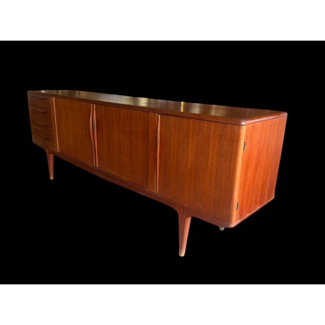 Beautiful 1960s teak sideboard with drawers, double doors with internal shelving, and a bar cabinet on the back door to...