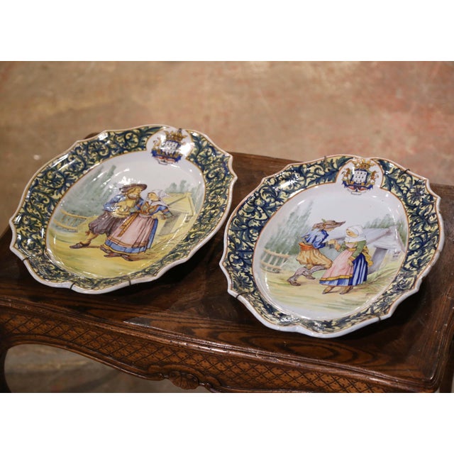 Decorate a kitchen wall or a shelf with this important pair of antique platters. Created by Porquier Beau in Quimper,...