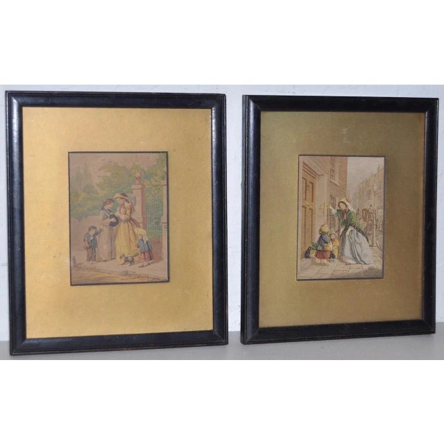 A pair of charming prints of everyday life in a European village. One shows the family out for a walk with the dog, the...