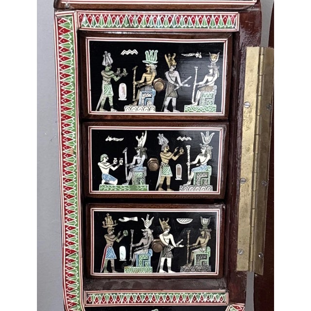 This product is a large 20.5 x 6 Egyptian Revival 1920s Mother of Pearl inlaid jewelry box. The intricate design and...