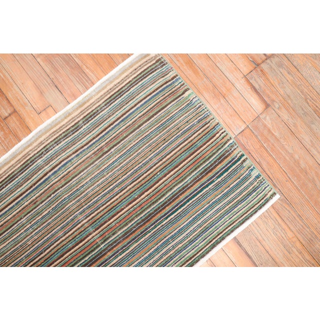 Mid-20th century Turkish Deco rug with a thin striped design. Measures: 2'5''x 3'11''.