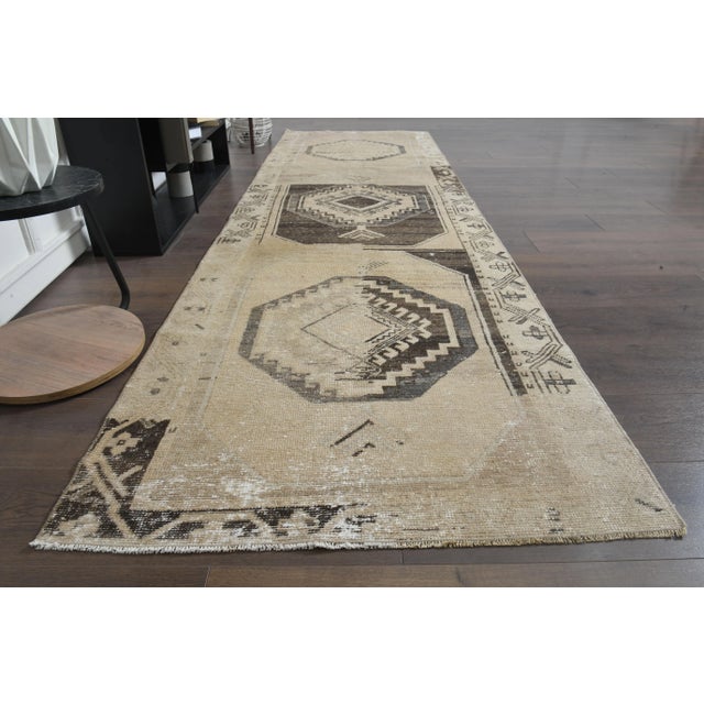 Vintage Turkish Hand-Knotted vintage rug is a semi- vintage runner rug.'70s Eastern region of Turkey's unique rug is...