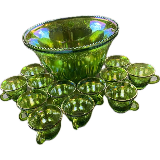 This beautiful vintage green carnival glass punch bowl set is the perfect addition to any gathering or celebration. The...