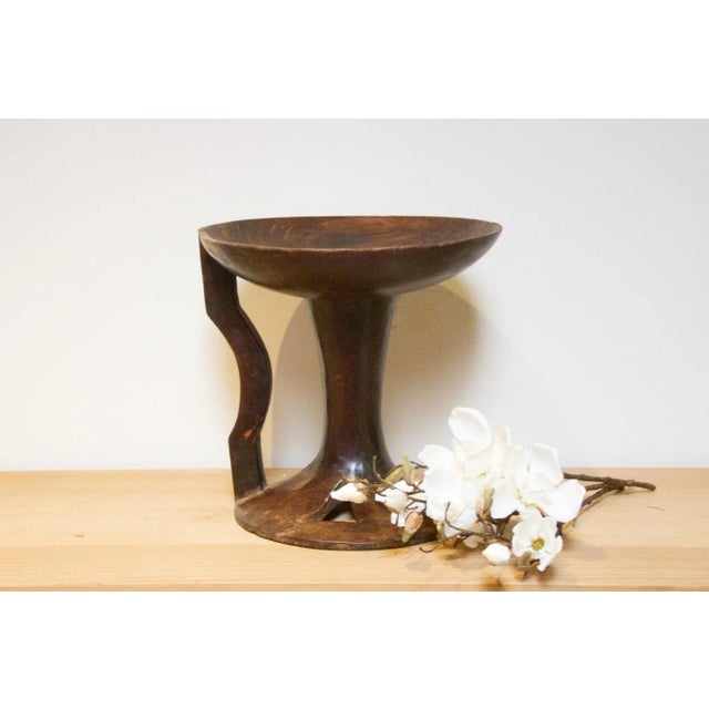 A vintage tribal Naga small side table, hailing from the enchanting tribal region of Nagaland in North Eastern India,...