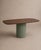 A sculptural table, where the warmth of dark walnut meets the delicate hues of sage green. The contoured top is...