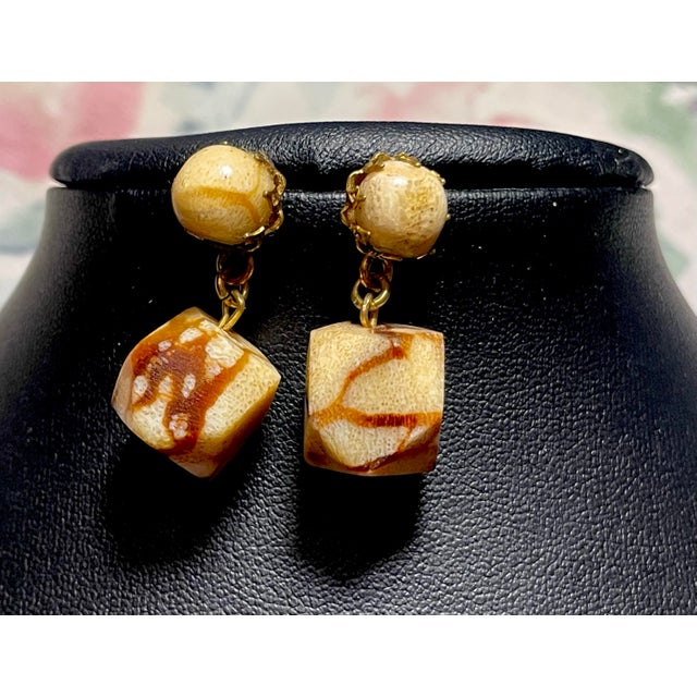 Signed Miriam Haskell dangle earrings of simulated fossil coral, or sponge coral art glass. The glass is molded and...