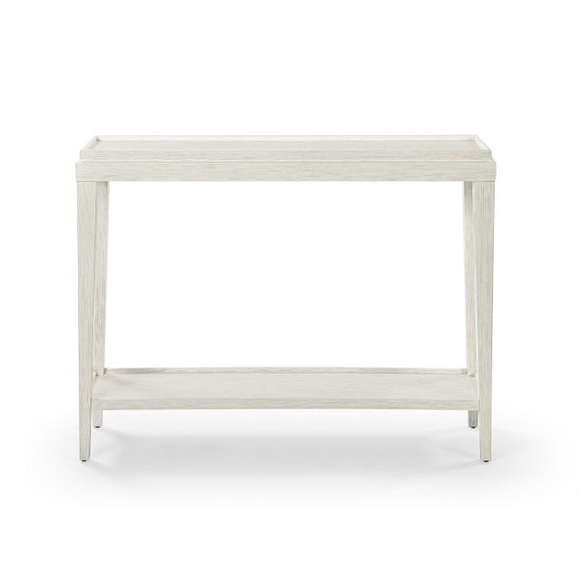 Crafted with a wooden galleried dish top and finished in a hand-rubbed with subtle distressing, this console table exudes...