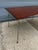 Ray and Charles Eames for Herman Miller Folding Rectangular Dining Table. Walnut refinished. Legs show typical wear and...