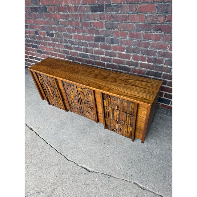 Vintage Lane dresser/credenza, often referred to as part of Lane’s Brutalist-style designs. The piece features a highly...