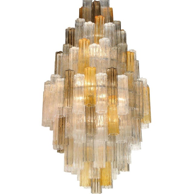 A spectacular seven-tier Murano blown glass "Tubi Tronchi" chandelier, attributed to Toni Zuccheri for Venini, combining...