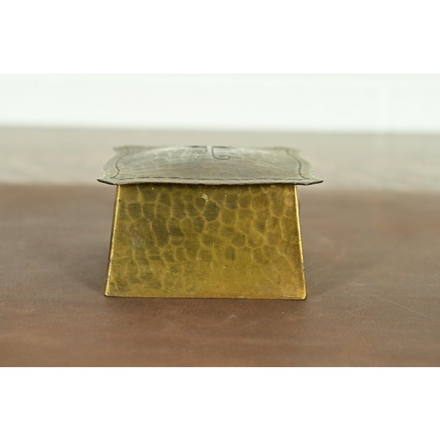 A gorgeous Arts & Crafts period brass finished hand hammered copper inkwell By Roycroft (signed with impressed orb and...
