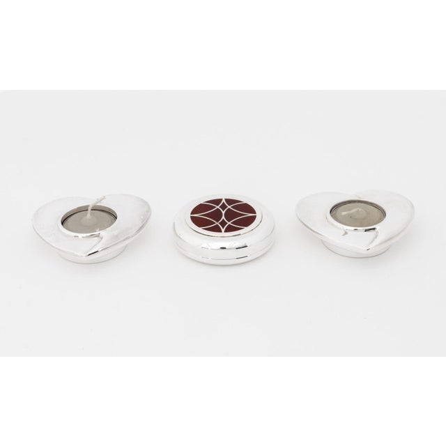Collection of Three Christofle Silver Plate Articles, comprising: pair of heart form votive candle holders, marked to the...