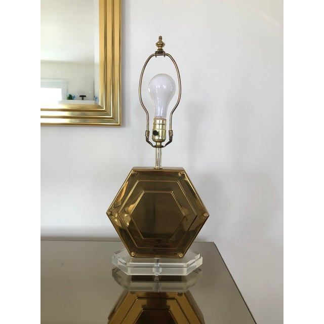 Classic Campaign style lamp. Brass hexagon with lucite base and acorn caps. 12” to base of socket