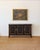 A sophisticated vintage ebonized sideboard inspired by French and English Neoclassical design, finished in a rich black...