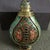 This is a beautifully crafted vintage Chinese cloisonné enamel snuff bottle, featuring a flattened, flask-like form with a...