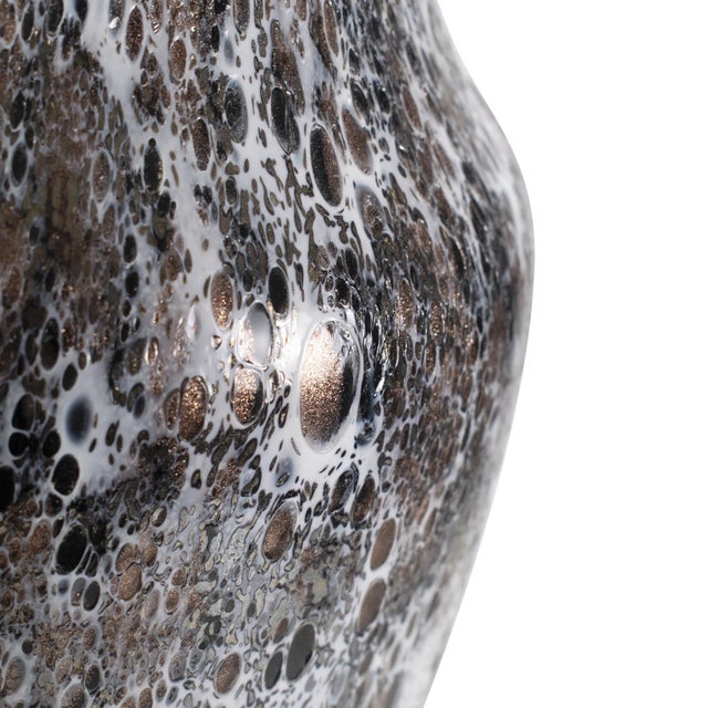 A blend of white, black, and bronze creates a rich and layered effect. The bronze detailing adds a subtle sparkle,...