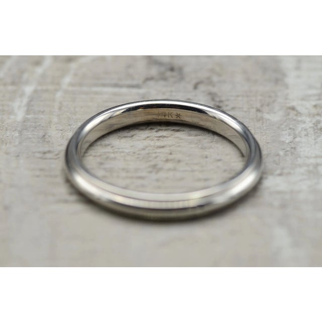 The Arneb Men's 14 K White Gold Comfort Fit Wedding Band. This classic men's band is crafted in 14 karat white gold and...