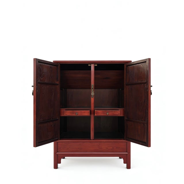 This 19th century armoire cabinet was handmade from sturdy catalpa wood and features a red finish with a traditional...