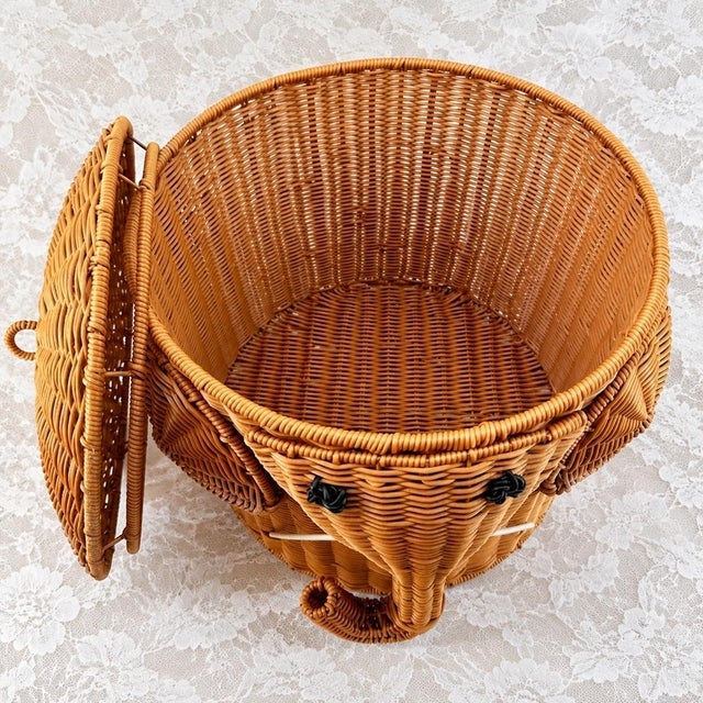 This storage container is hand-woven and shaped by craftsmen from natural rattan, creating a three-dimensional elephant...