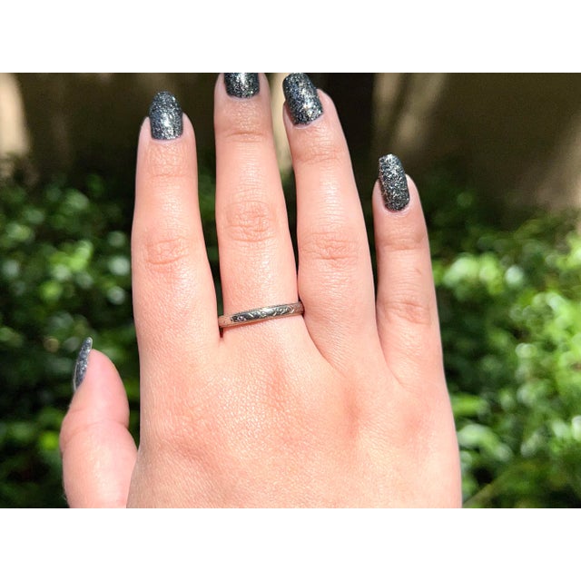 About This Ring: Are you looking for the perfect timeless wedding band with a romantic history? This classic white gold...