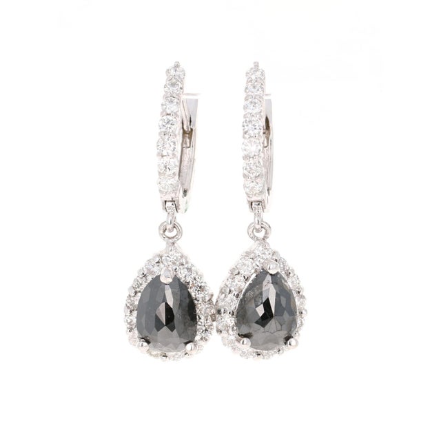 These beauties have 2 Black Pear Cut Diamonds that weigh 2.54 Carats and 40 Round Cut Diamonds that weigh 1.21 Carats. The...