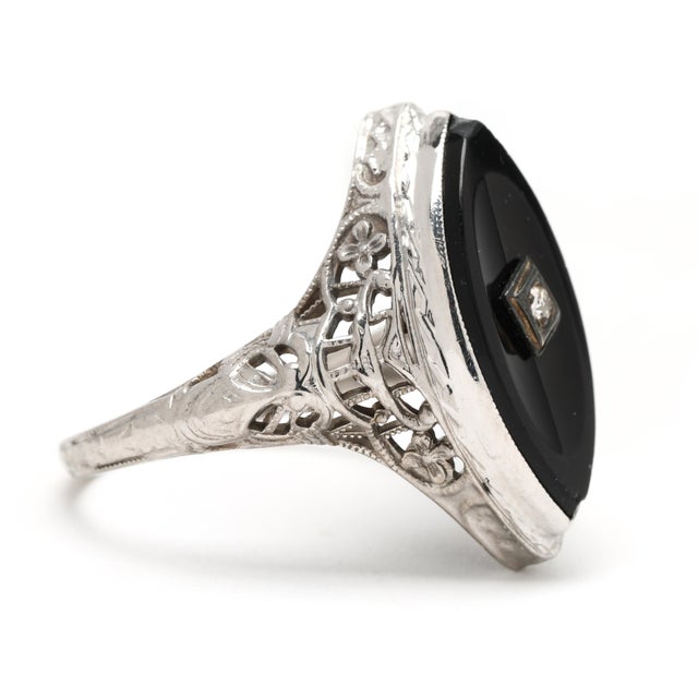 Stones: black onyx diamond Ring Size: 6 Rise Off Of Finger: 4.6 mm Length: 19.9 mm Weight: 1.9 dwts/ 2.9 grams Metal:...