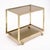 Modernist French bar cart made of brass and chrome by iconic Italian designer Romeo Rega. This piece has a top and bottom...