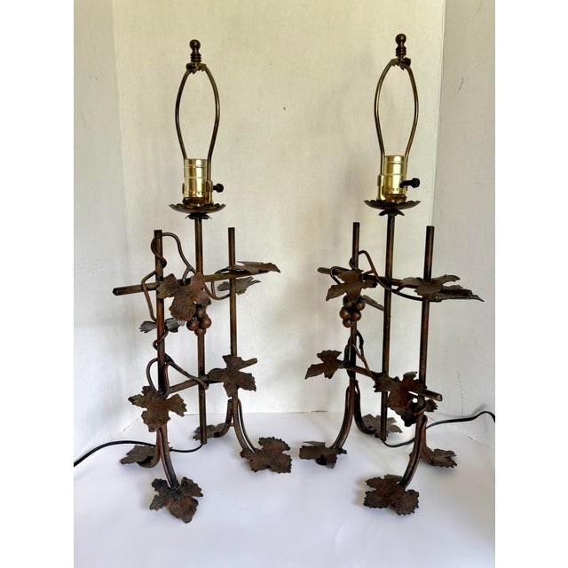 Here is a wonderful pair of table lamps that depict a grapevine growing on a trellis. I adore the shape of the figurative...