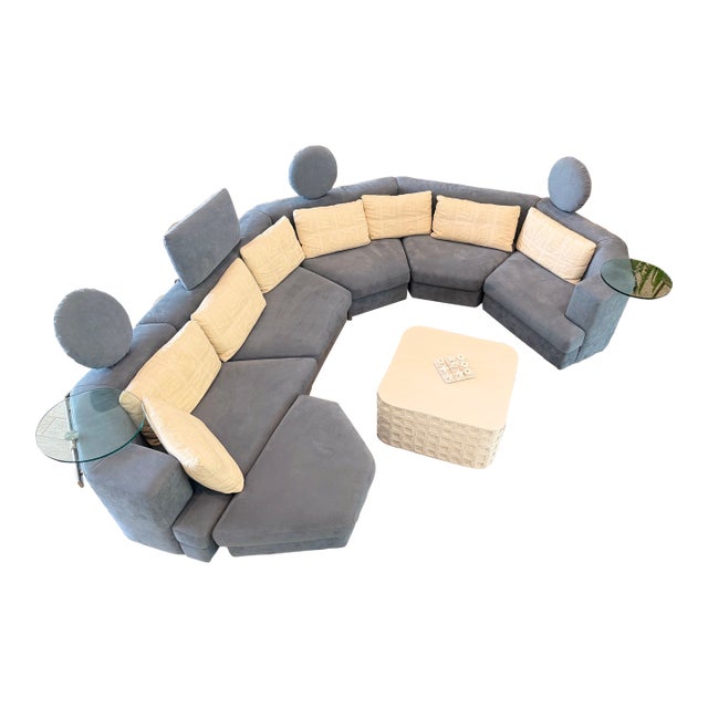 Experience timeless German design and craftsmanship with this striking Rolf Benz Model 200 modular sectional in light blue...