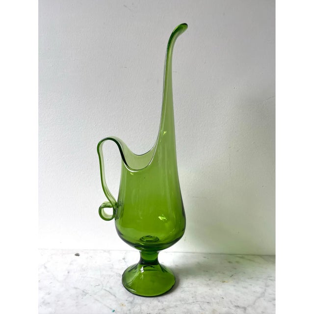 Stunning rare L.E. Smith Company Viking swing pitcher. Gorgeous transparent green glass. Beautiful curves and detail. L.E....