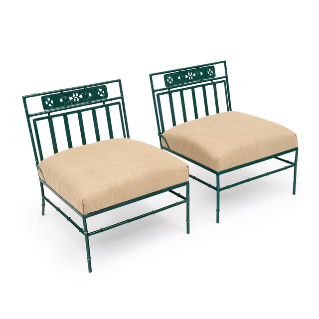 Pair of lounge chairs from France. This pair is made of iron that has been painted in a wonderful emerald, green tone. The...