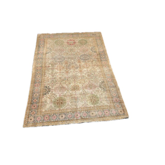 This refined mid 19th century Turkish silk rug exemplifies the delicate artistry of Ottoman weaving traditions. The field...