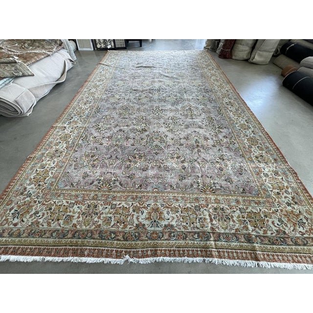 This Antique Distressed Mahal is an all wool Handmade and Hand knotted rug. It has an all over design from the 20th...
