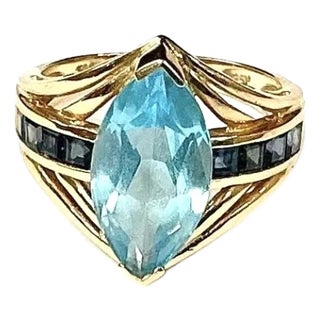 Light Blue Topaz With Dark Blue Topaz Baguettes 14k Yellow Gold Ring For Sale