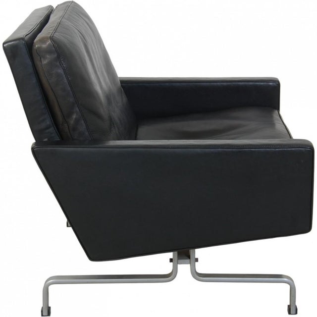 Poul kjærholm pk31 armchair upholstered in black leather, and with a frame of chrome spring steel. The chair is from the...