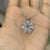 This elegant pendant features 1.88 ct pear and round moissanites, handcrafted in 925 sterling silver. Designed in a...
